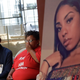 A photo of stabbing victim Nia Wilson, right, is displayed at a news conference as her father Ansar El Muhammad, left, and her mother Alicia Grayson listen during a news conference in San Francisco.